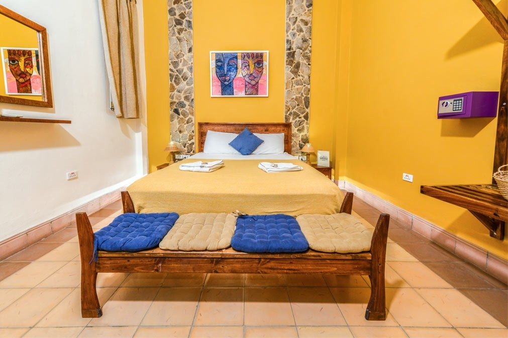 The Yellow room in La Gargola guesthouse in Old Havana, Cuba