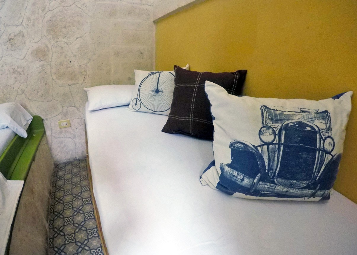 The small single bed in Room 3 of Casa La Obrapia guesthouse in Old Havana