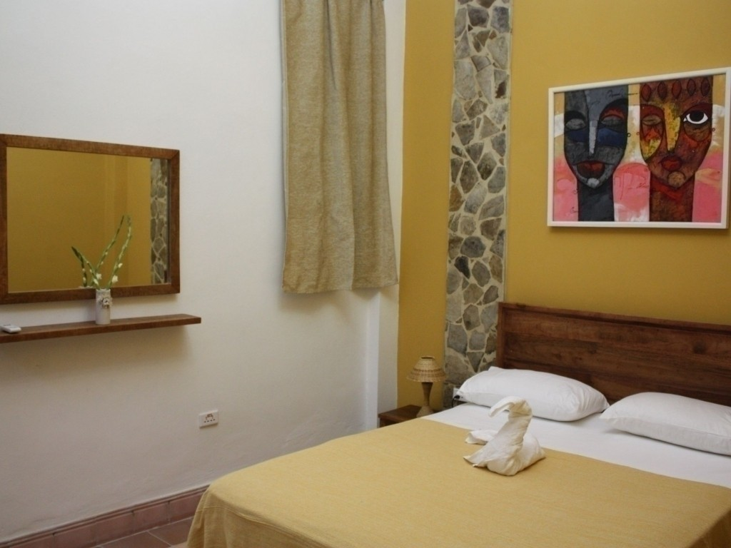 The Yellow Room at La Gargola guesthouse in Old Havana, Cuba